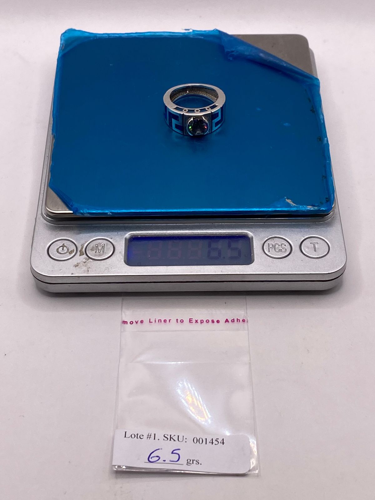 Anillo Geométrico de Plata Ley 925 con Ópalo de Fuego y Zirconia Tornasol, peso en gramos (báscula)
