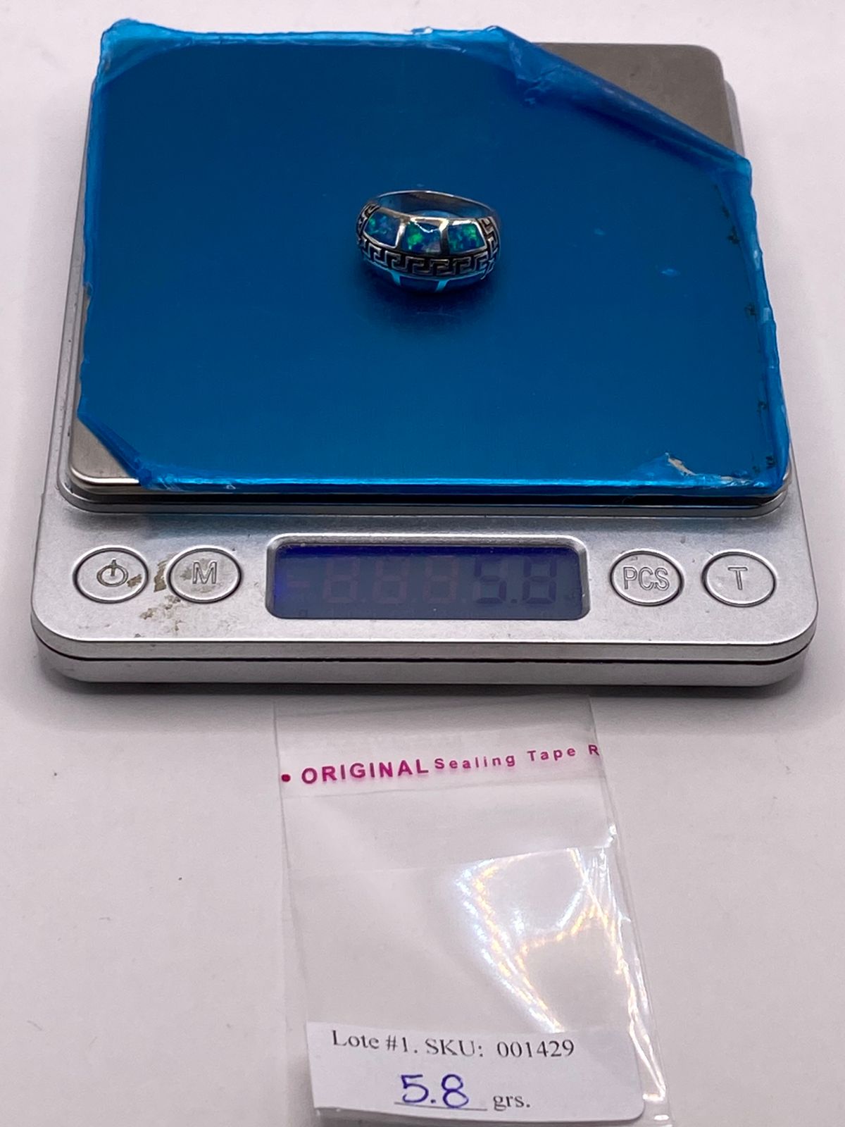 Anillo Greca de Plata Ley 950 con Ópalo de Fuego, peso en gramos (báscula)