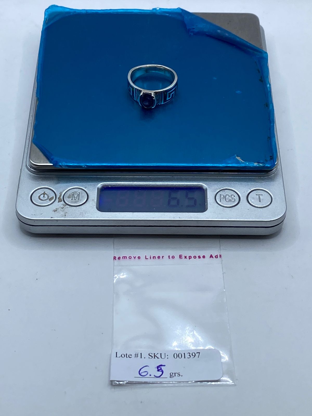 Anillo Greca de Plata .950 con Ópalo de Fuego y Zirconia Azul, peso en gramos (báscula)