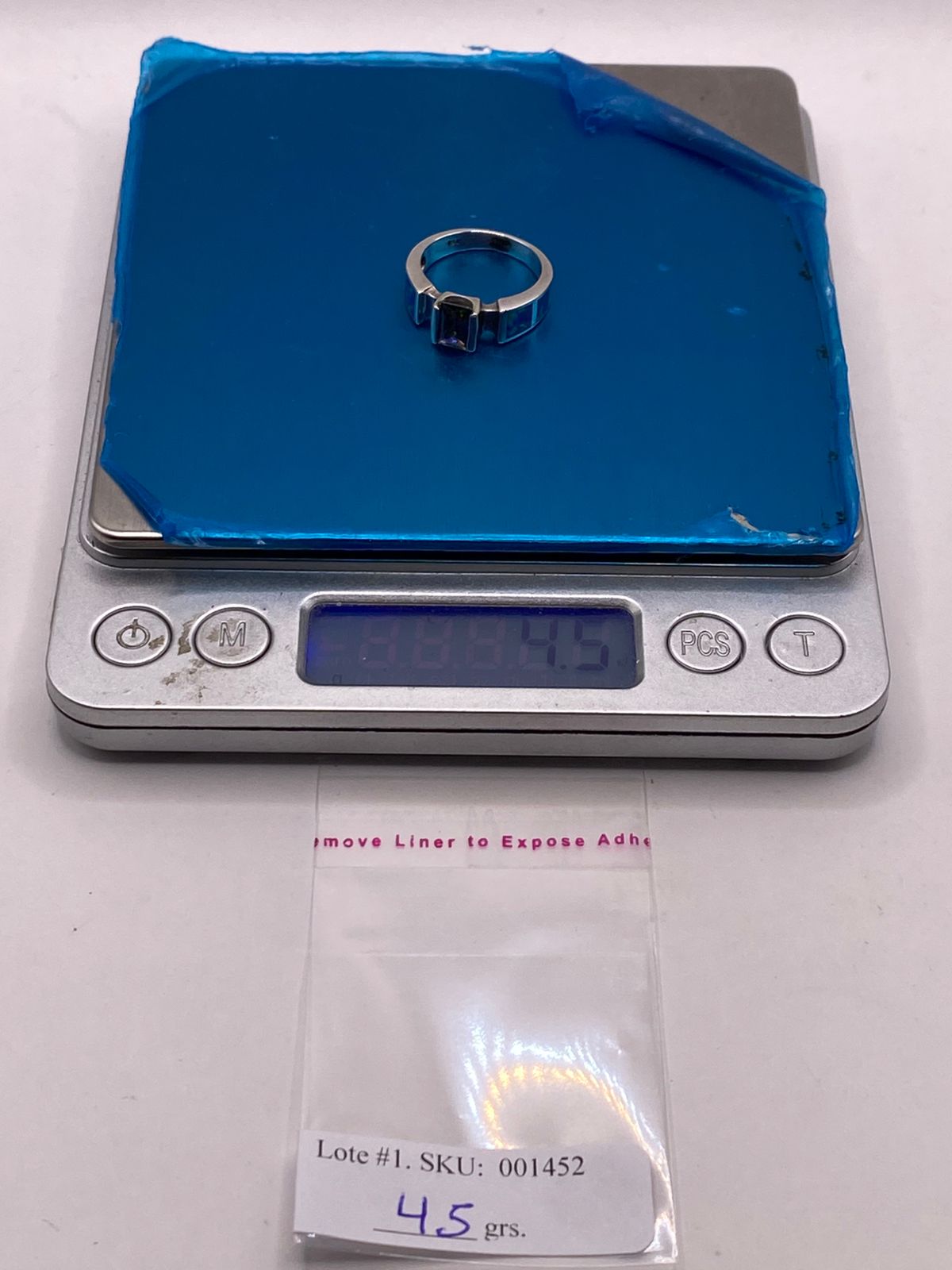 Anillo Solitario de Plata Ley 950 con Ópalo de Fuego y Zirconia Multicolor, peso en gramos (báscula)
