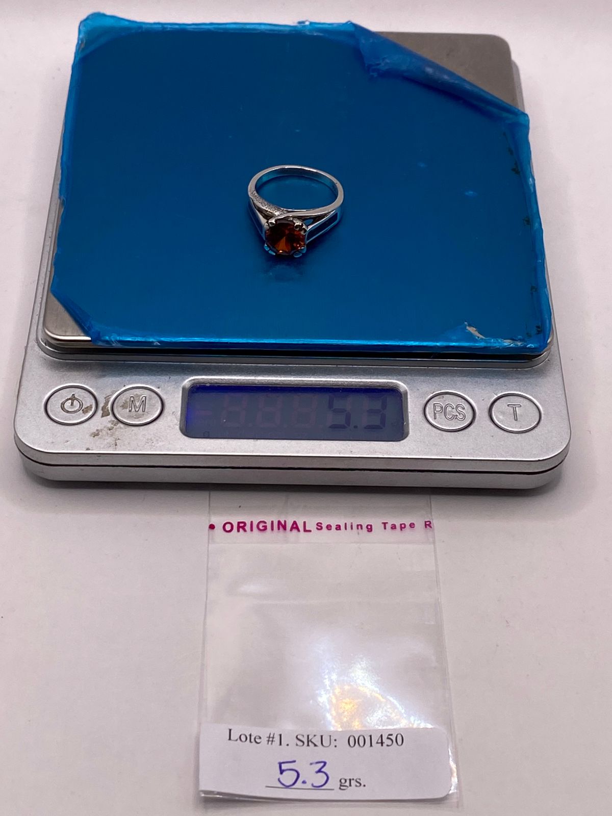 Anillo Solitario de Plata Ley 950 con Ópalo de Fuego y Zirconia Naranja, peso en gramos (báscula)