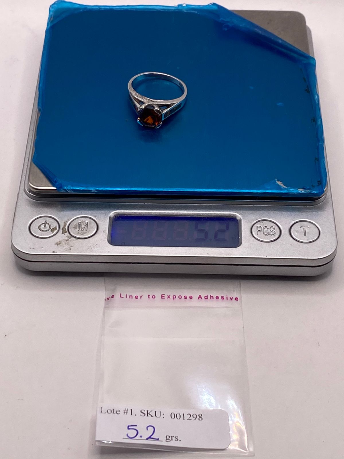Anillo Solitario de Plata .950 con Zirconia Naranja y Ópalo de Fuego, peso en gramos (báscula)