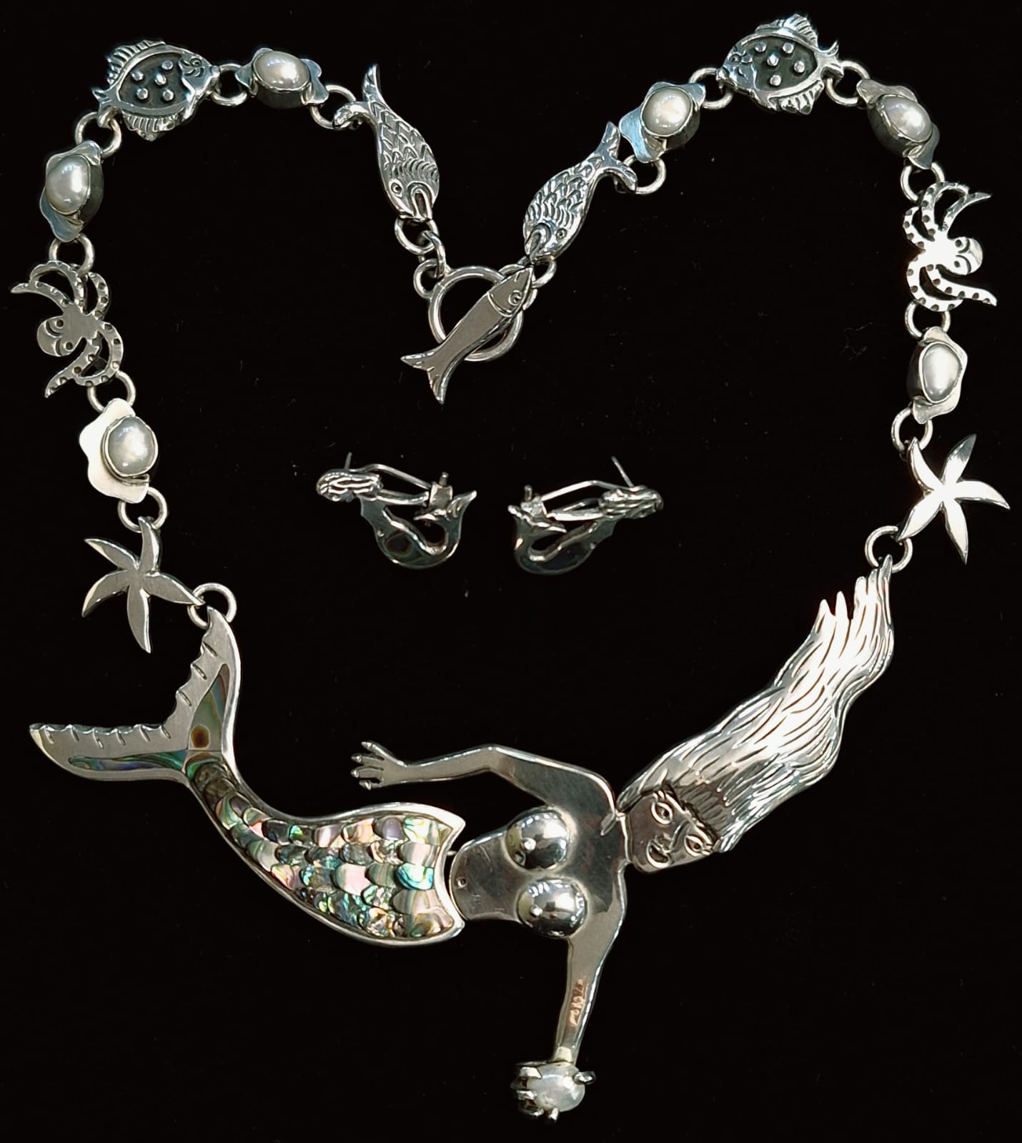 Sello de ley en el interior del set de collar con incrustaciones de abulon en plata ley 925