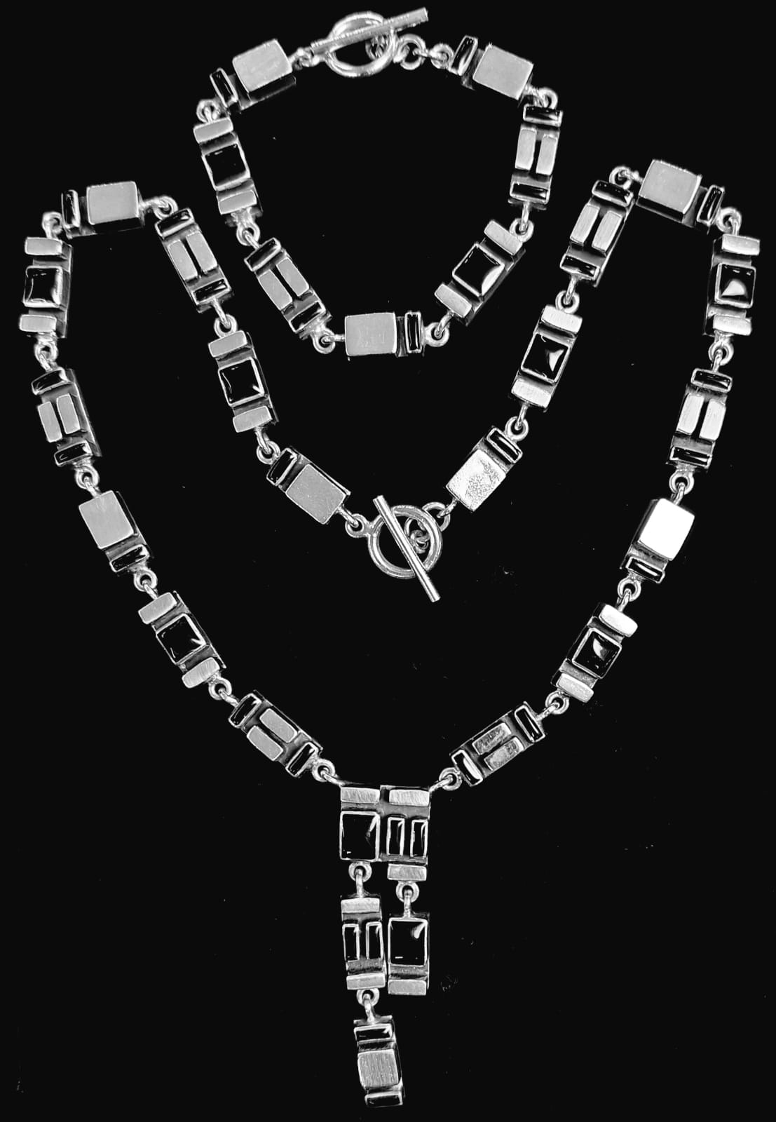 Sello de ley en el interior del set de collar mosaico con incrustaciones de obsidiana en plata ley 925