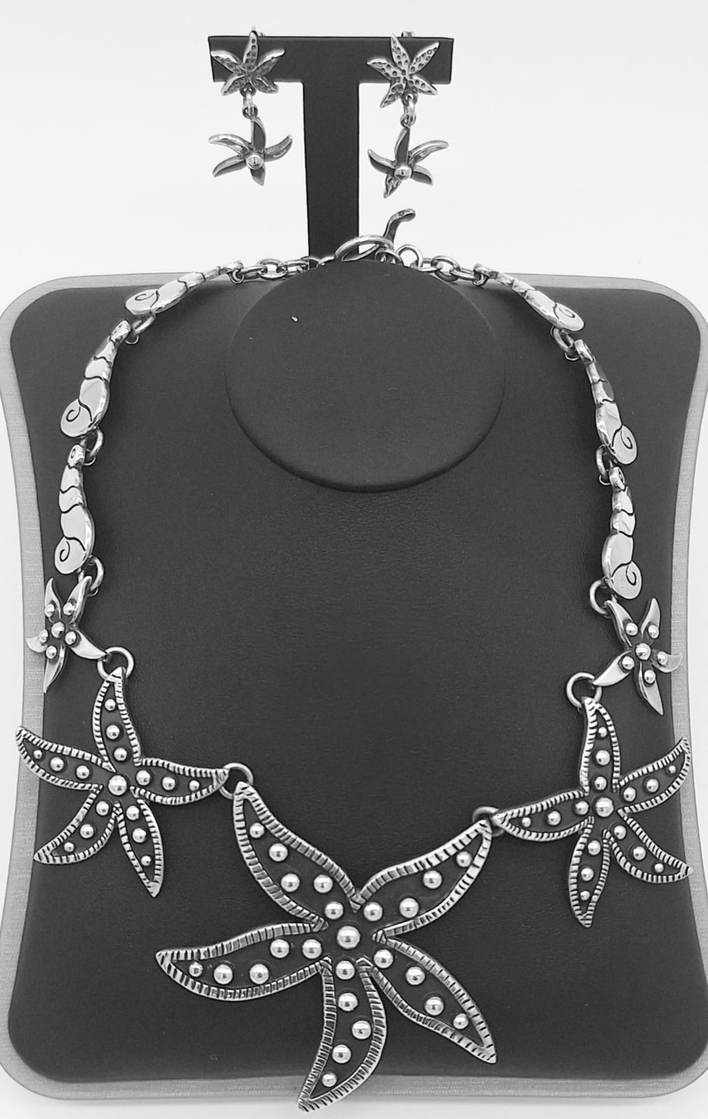 Sello de ley en el interior del set de collar y arete, estrella de mar de plata ley 925.