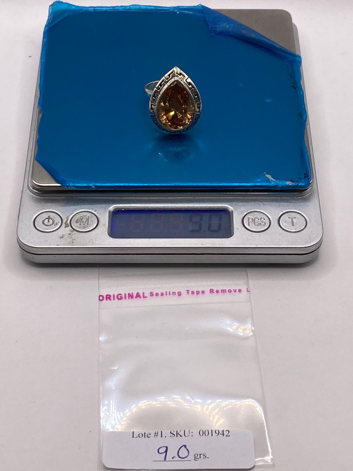 Anillo Ajustable de Plata Ley 925 con Zirconia Ámbar Tipo Gota, peso en gramos (báscula)