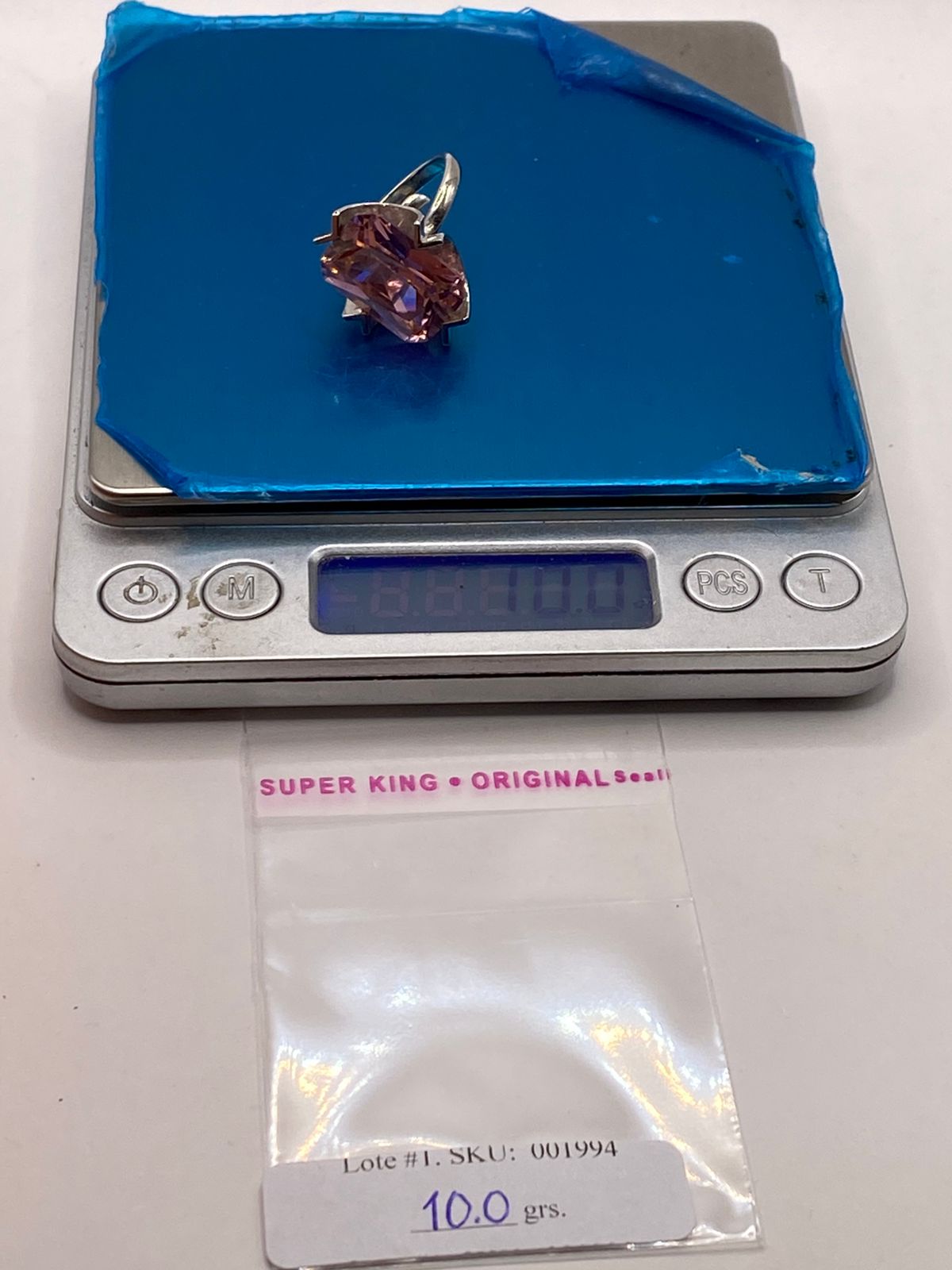 Anillo Ajustable de Plata Ley 925 con Zirconia Rosa Diseño Escultural, peso en gramos (báscula)