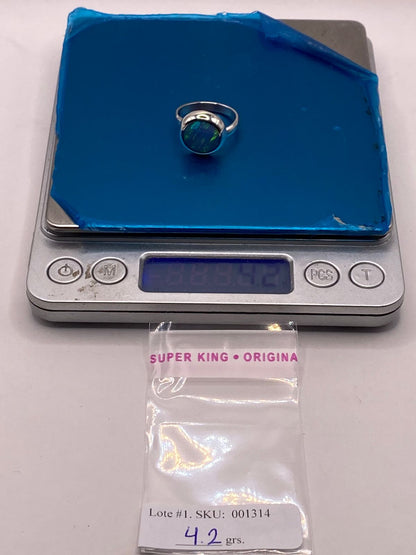 Anillo Ajustable de Plata .925 con Ópalo de Fuego Azul-verde Diseño Moderno, peso en gramos (báscula)