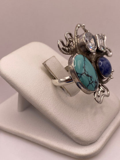 Anillo Artístico de Plata Ley 925 con Turquesa, Sodalita y Zirconias, vista frontal