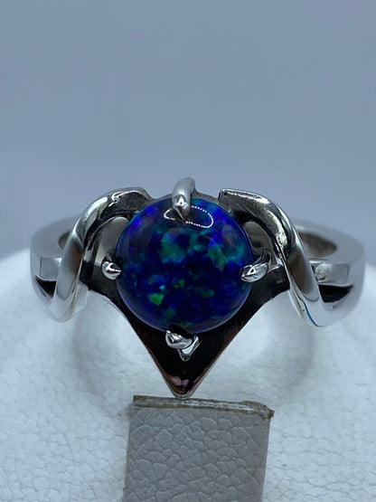 Anillo Contemporáneo de Plata .925 con Ópalo de Fuego, sello de autenticidad Plata Ley .925