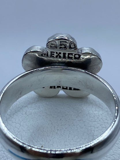 Anillo Flor de Plata .950 con Ópalo de Fuego, sello de autenticidad Plata Ley .925