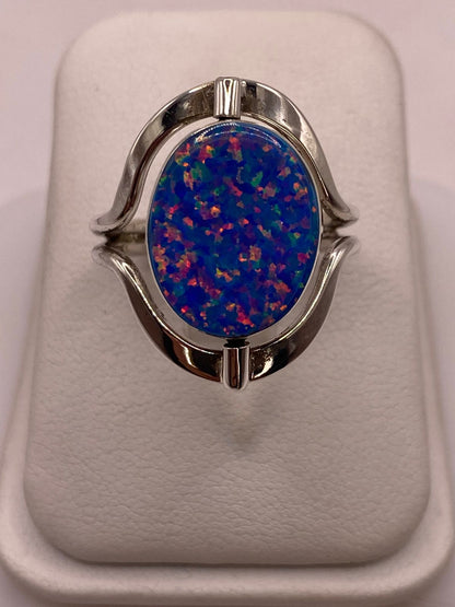 Anillo Giratorio Doble Vista de Ópalo de Fuego en Plata .925, vista frontal