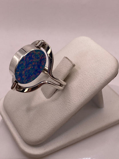 Anillo Giratorio Doble Vista de Ópalo de Fuego en Plata .925, vista lateral