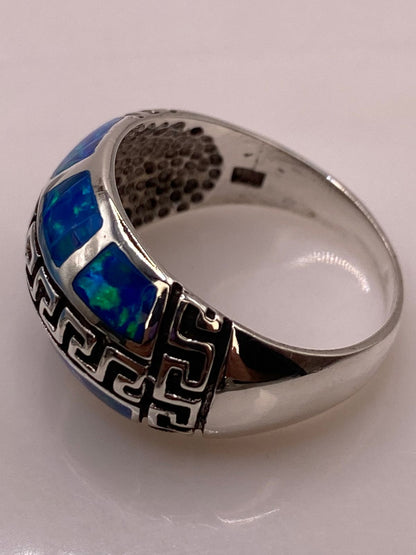 Anillo Greca de Plata Ley 950 con Ópalo de Fuego, sello de autenticidad Plata Ley .925