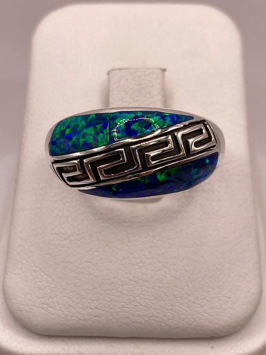 Anillo Greca de Plata Ley 950 con Ópalo de Fuego Azul Marino en báscula mostrando peso