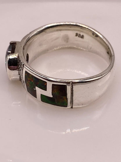 Anillo Greca de Plata Ley 950 con Ópalo de Fuego y Zirconia, sello de autenticidad Plata Ley .925
