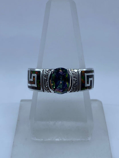 Anillo Greca de Plata .950 con Ópalo de Fuego y Zirconia Tornasol, vista lateral