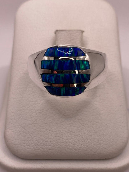 Anillo de Ópalo de Fuego Azul Iridiscente en Plata Ley 950, vista lateral
