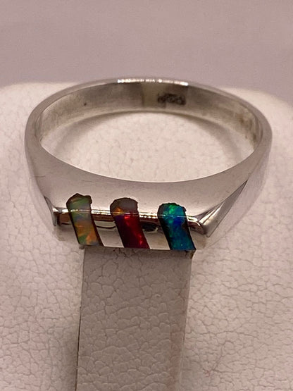 Anillo con Ópalo de Fuego Multicolor en Plata Ley .925, sello de autenticidad Plata Ley .925
