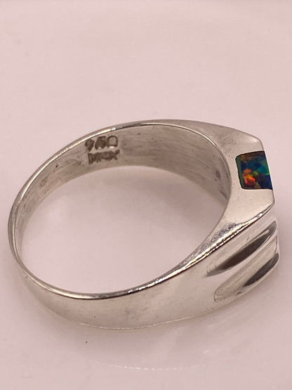 Anillo con Ópalo de Fuego Multicolor en Plata Ley .950, sello de autenticidad Plata Ley .925