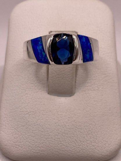 Anillo con Ópalo de Fuego y Zirconia Azul en Plata Ley .950 — ángulo diagonal