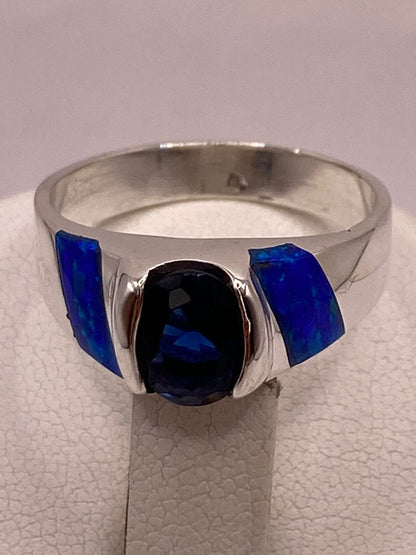 Anillo con Ópalo de Fuego y Zirconia Azul en Plata Ley .950, sello de autenticidad Plata Ley .925