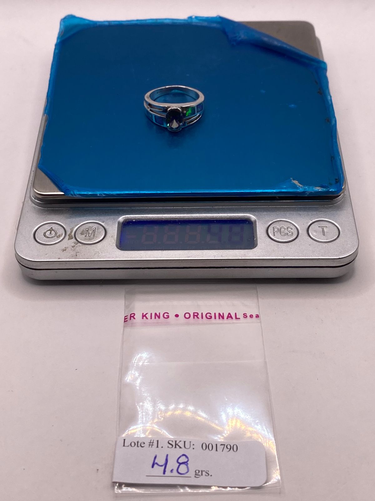Anillo con Ópalo de Fuego y Zirconia Multicolor en Plata Ley .950, peso en gramos (báscula)