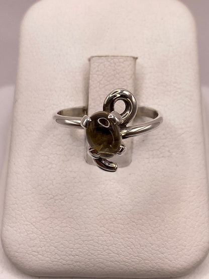 Anillo de Plata Ley 925 con Ámbar Ahumado en báscula mostrando peso