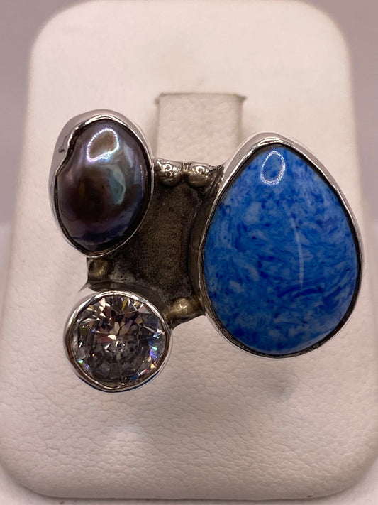 Anillo de Plata Ley 925 con Jaspe Azul, Nácar y Zirconia — detalle de acabado