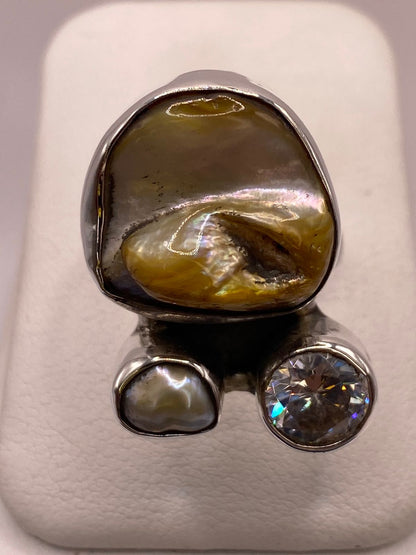 Anillo de Plata Ley 925 con Nácar y Zirconia, vista lateral