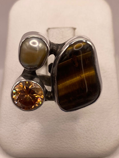 Anillo de Plata Ley 925 con Ojo de Tigre, Nácar y Zirconia, vista superior