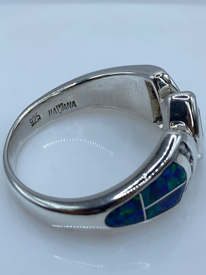 Anillo de Plata Ley 925 con Ópalo de Fuego Azul y Zirconia Verde Olivo, sello de autenticidad Plata Ley .925