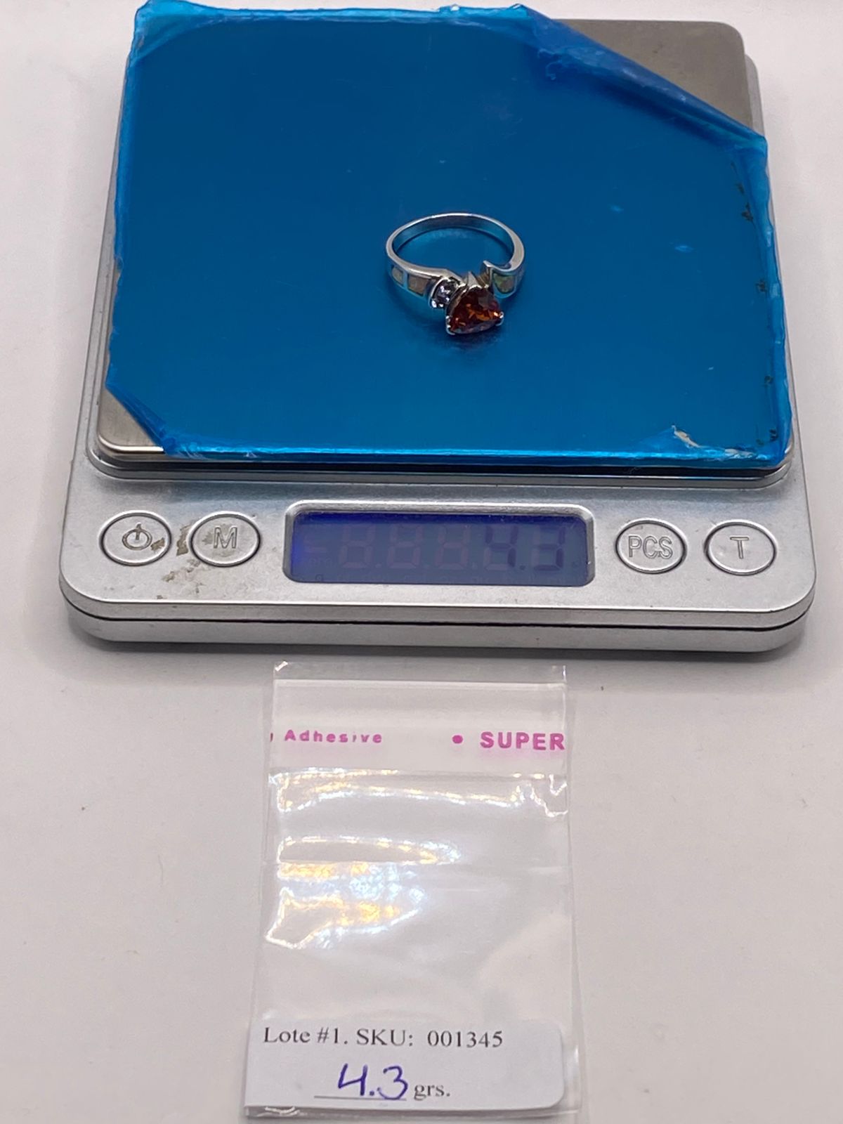 Anillo de Plata Ley 925 con Ópalo de Fuego, Zirconias y Piedra Central Naranja, peso en gramos (báscula)