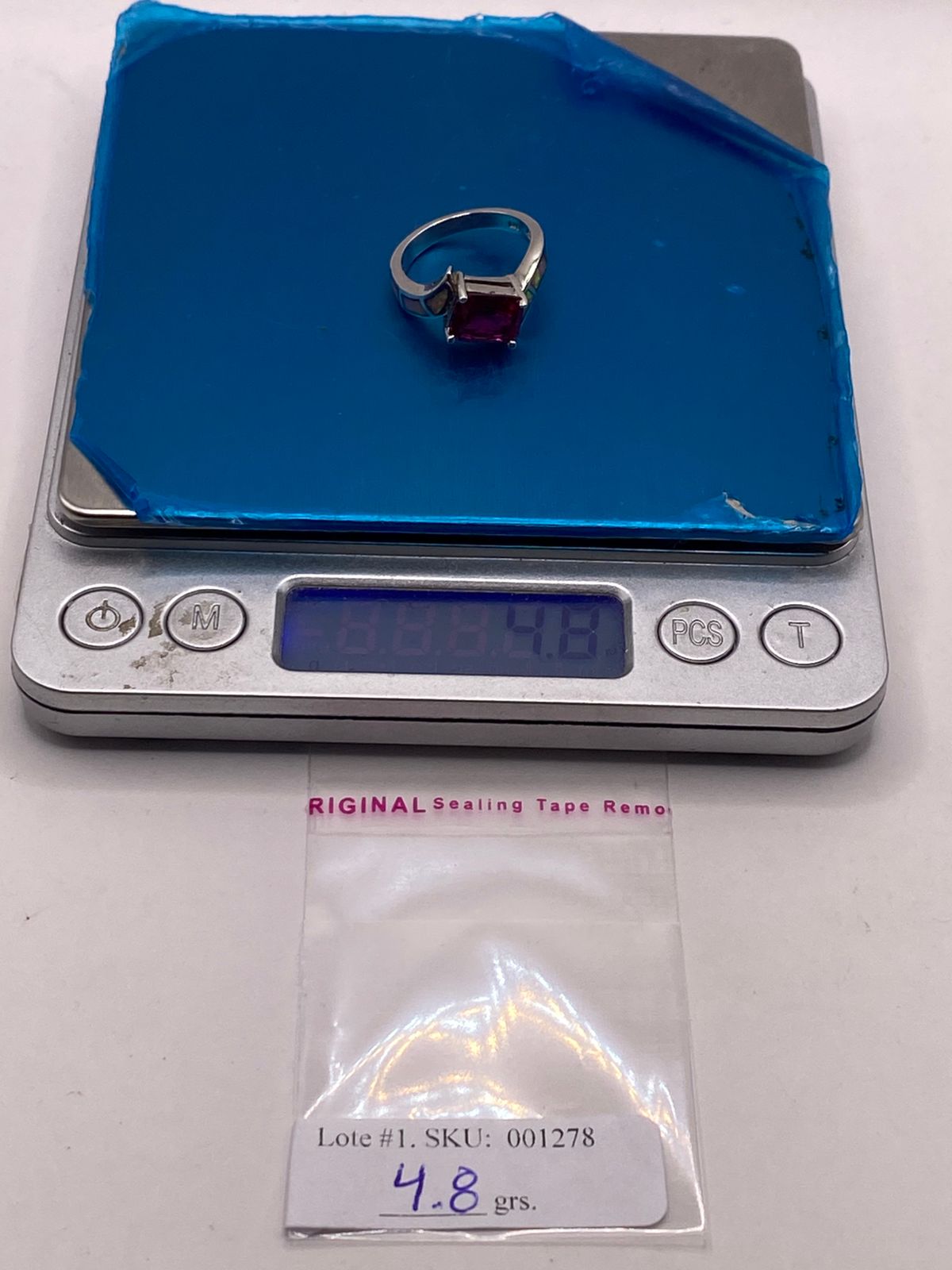 Anillo de Plata Ley 925 con Zirconia Fucsia y Ópalo de Fuego, peso en gramos (báscula)