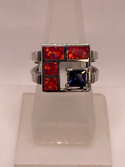 Anillo de Plata .950 con Ópalo de Fuego y Zirconia Azul Diseño Geométrico Moderno, vista lateral