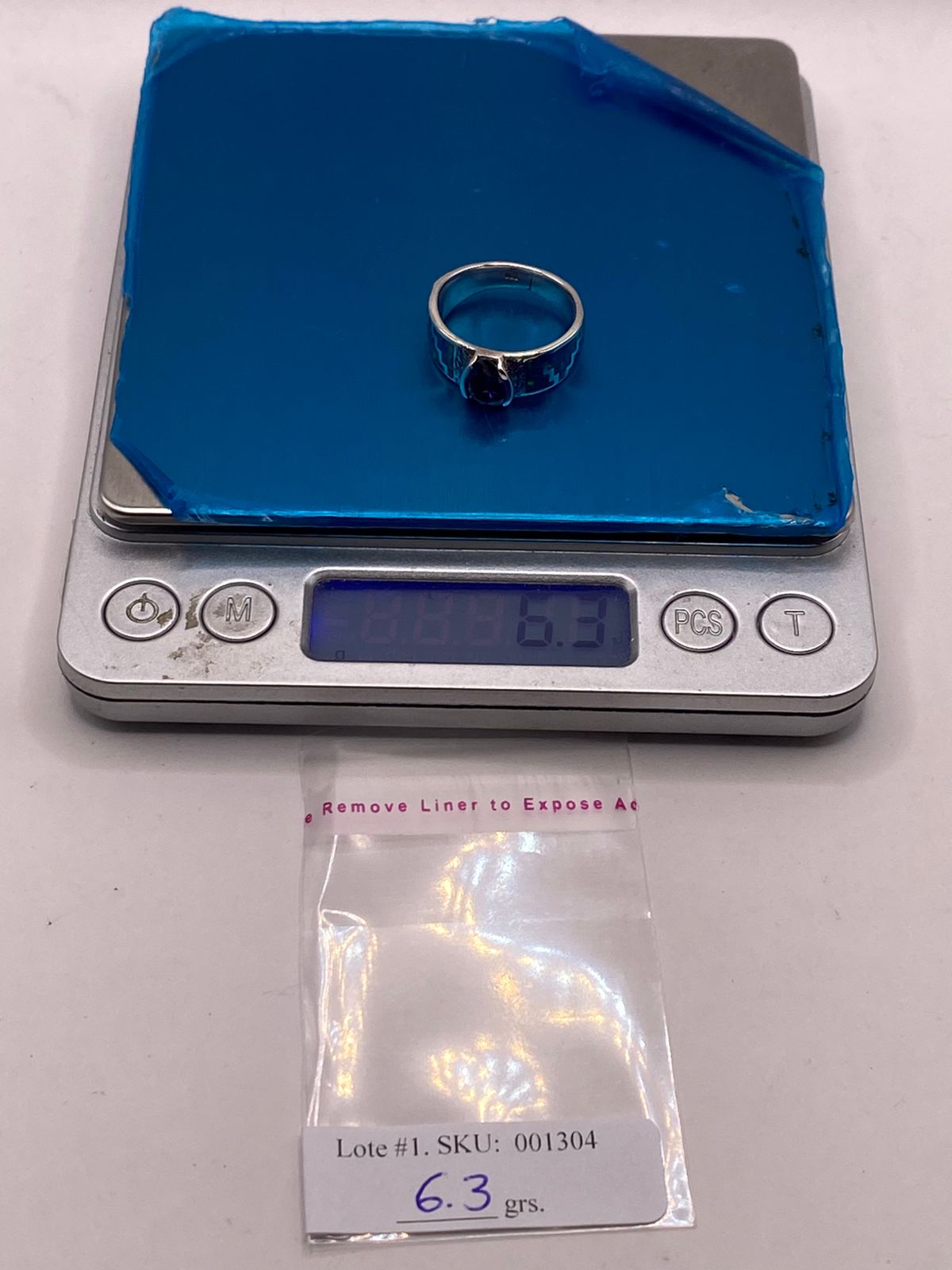 Anillo de Plata .950 con Zirconia Azul y Ópalo Diseño Greca, peso en gramos (báscula)