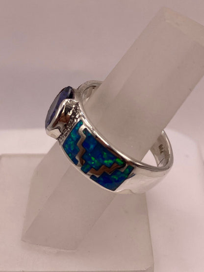 Anillo de Plata .950 con Zirconia Azul y Ópalo Diseño Greca, sello de autenticidad Plata Ley .925