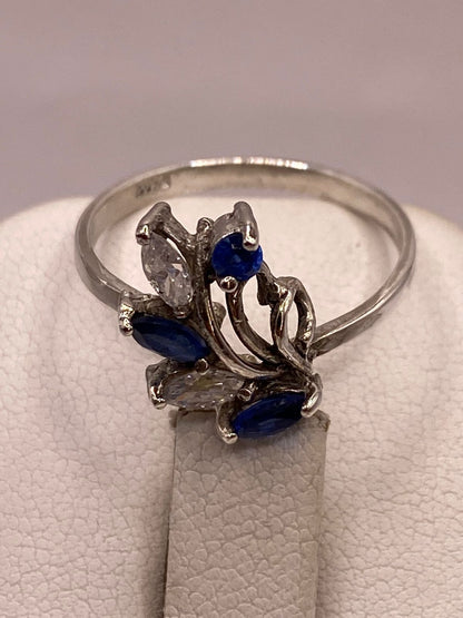 Anillo de Plata 925 con Zirconias Azules y Blancas, Diseño Floral Abstracto, sello de autenticidad Plata Ley .925
