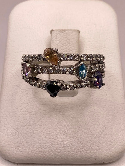 Anillo de Plata 925 con Zirconias Multicolor, Diseño Triple Banda — ángulo diagonal