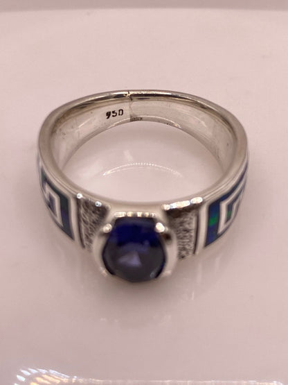 Anillo de Plata .950 con Ópalo de Fuego y Zirconia Azul – Diseño Greca, vista superior