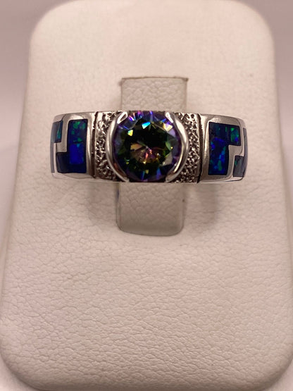 Anillo de Plata .950 con Ópalo de Fuego y Zirconia Multicolor Diseño Greca, vista lateral