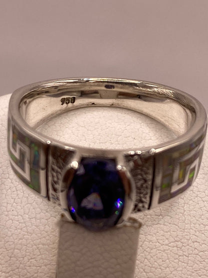 Anillo de Plata .950 con Ópalo de Fuego y Zirconia Azul – Diseño Greca, sello de autenticidad Plata Ley .925