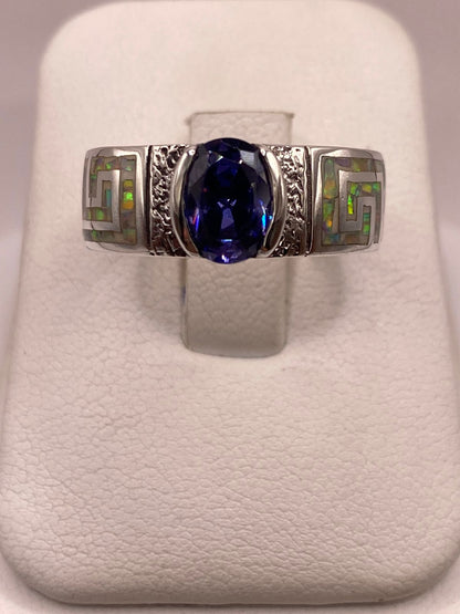 Anillo de Plata .950 con Ópalo de Fuego y Zirconia Azul Diseño Greca — ángulo diagonal