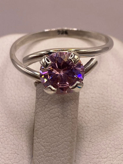 Anillo Solitario Cruzado de Plata Ley 925 con Zirconia Rosa, sello de autenticidad Plata Ley .925