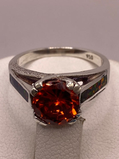 Anillo Solitario de Plata Ley 950 con Ópalo de Fuego y Zirconia, sello de autenticidad Plata Ley .925