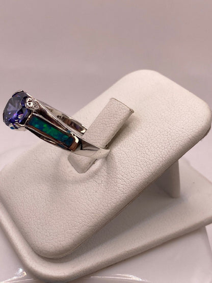 Anillo Solitario de Plata Ley 950 con Ópalo de Fuego y Zirconia Azul, vista lateral