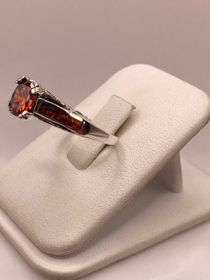 Anillo Solitario de Plata .950 con Zirconia Naranja y Ópalo de Fuego, vista frontal