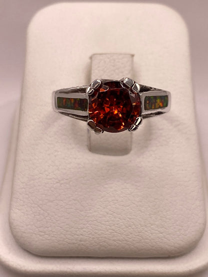 Anillo Solitario de Plata .950 con Zirconia Naranja y Ópalo de Fuego, vista lateral