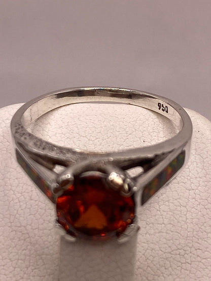 Anillo Solitario de Plata .950 con Zirconia Naranja y Ópalo de Fuego, sello de autenticidad Plata Ley .925