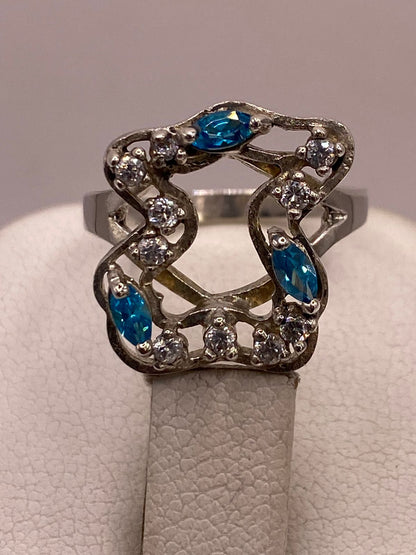 Anillo Tipo Osito de Plata Ley 925 con Zirconias Azules, vista superior